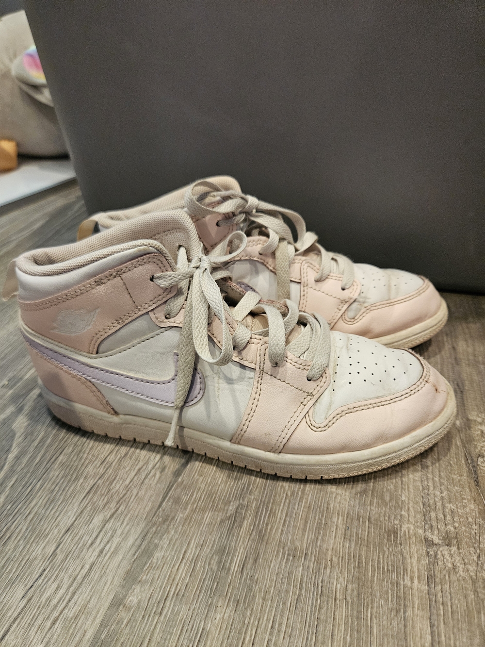 Nike Air Jordan 1 Mid "Pink Wash" shoes.